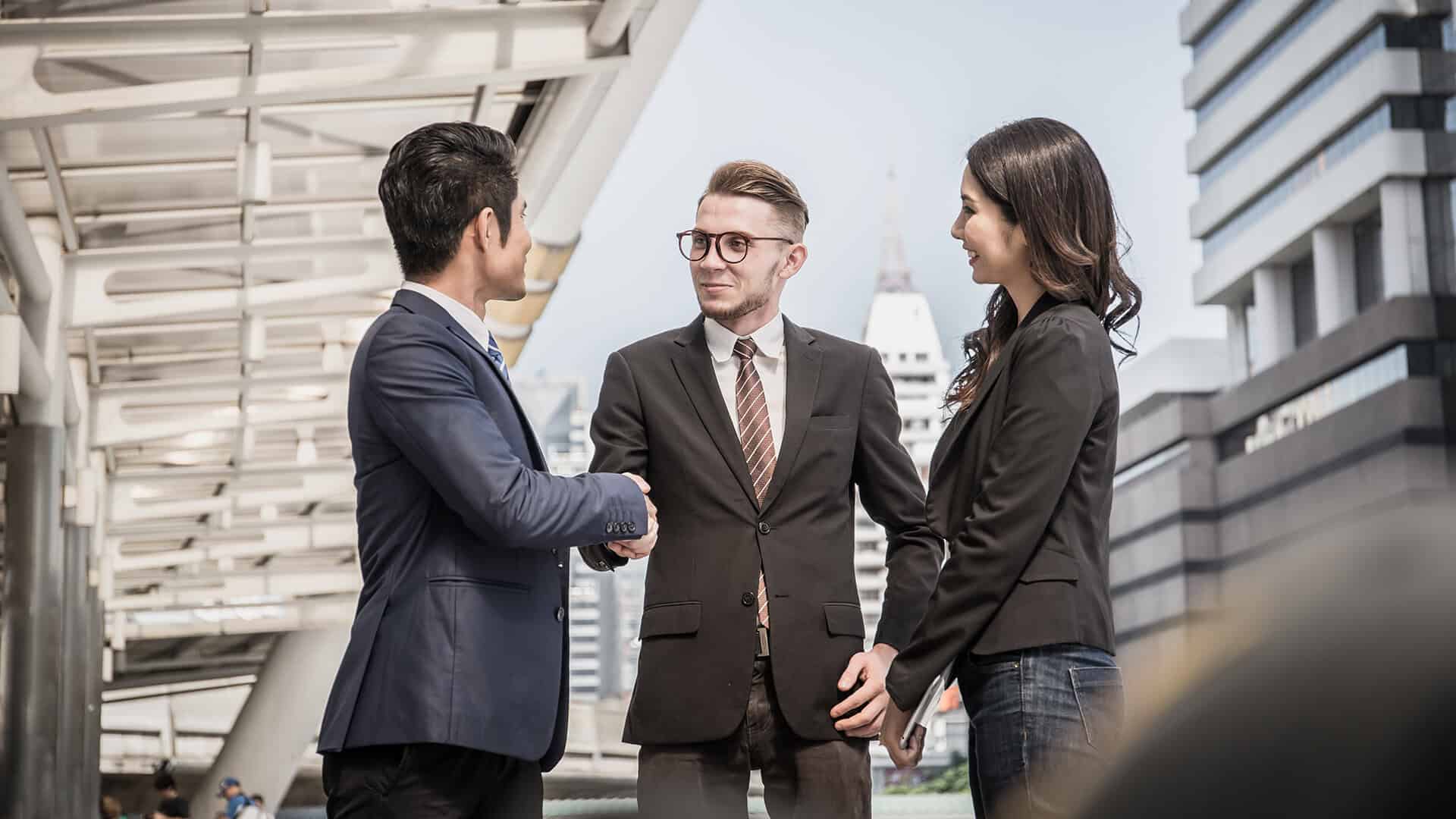 Businessman referring another business owner