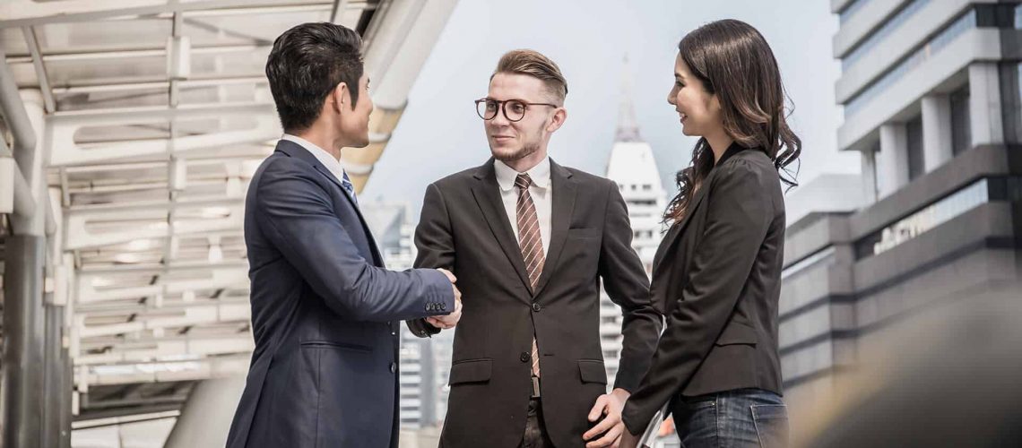 Businessman referring another business owner